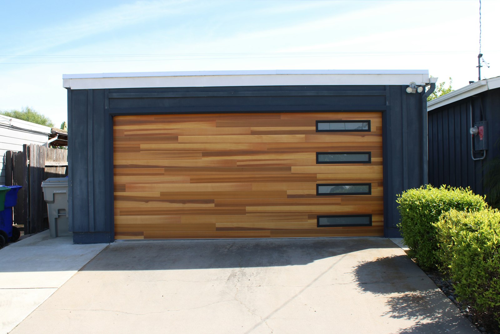 Wood-look garage door with window inserts