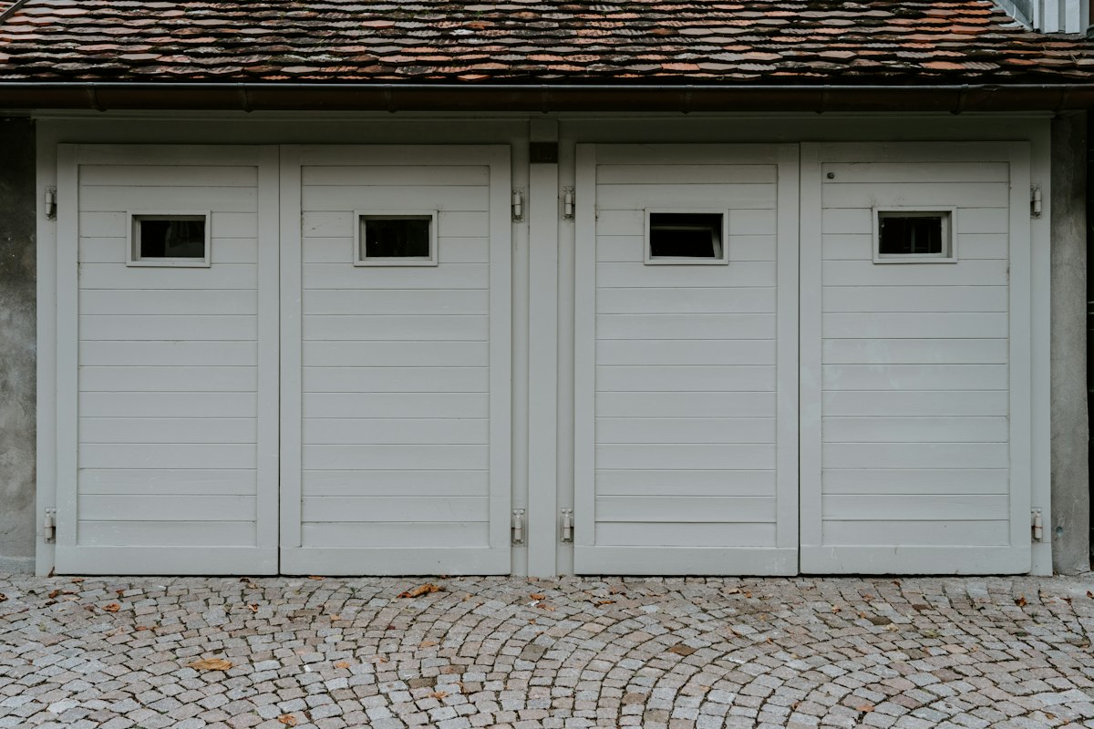 White garage door on a single-story home