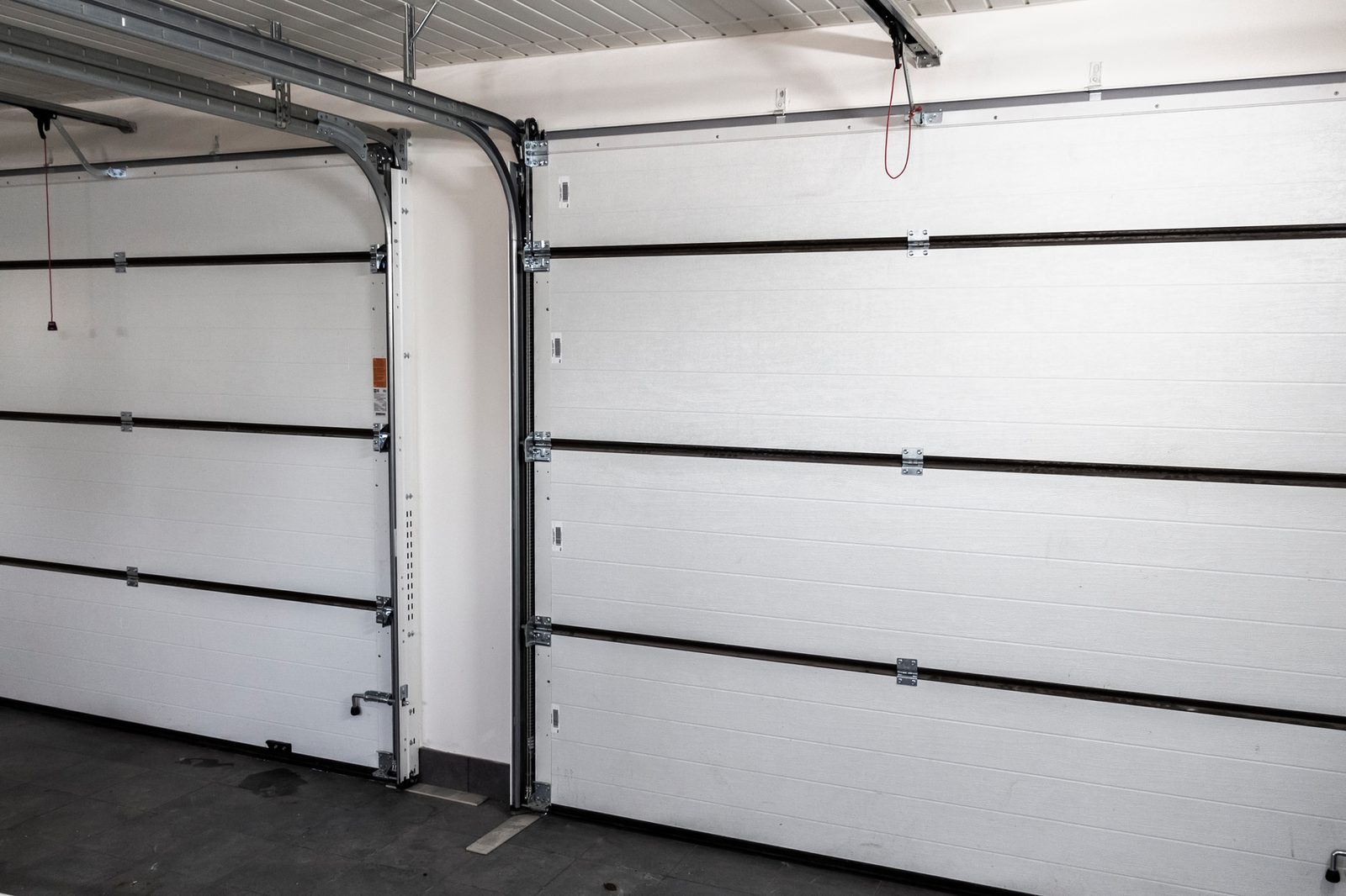 Interior of a closed sectional garage door with tracks and hardware